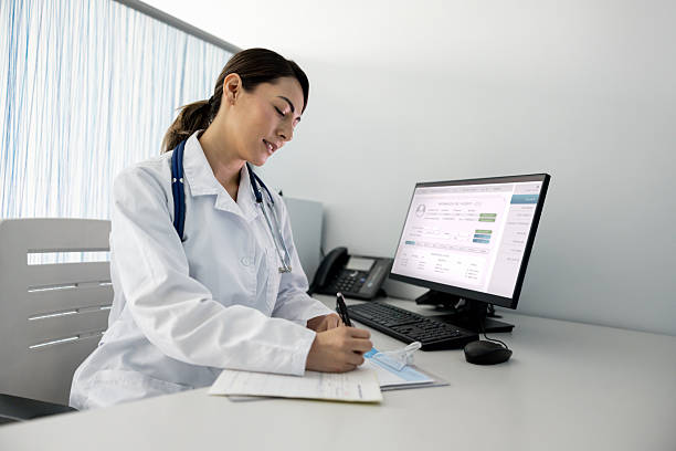 istock Doctor writing a prescription while working in the consultation room 2219405155