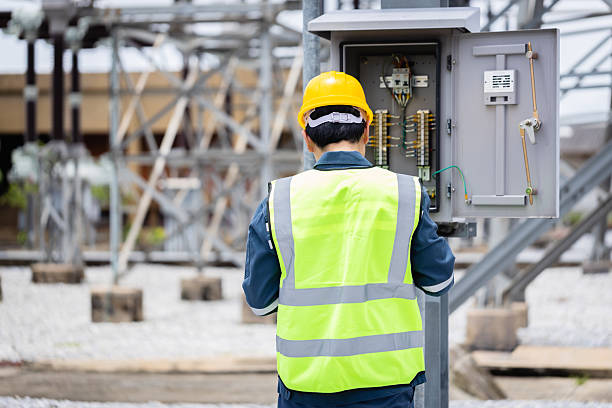 istock Engineer is working at high voltage substation performing inspection and check on power infrastructure to ensure safety and proper operation of electrical systems 2219405344