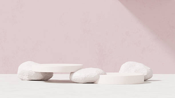 istock Background featuring an empty product display mockup with a pink backdrop and abstract geometric platforms designed for showcasing merchandise in landscape orientation. 2219407389