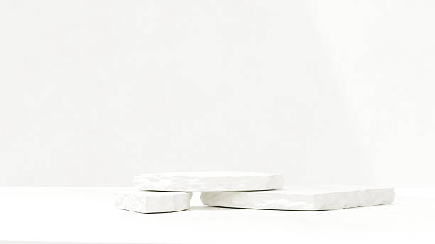 istock Premium simple minimalist white marble stone plate podium and chrysanthemum flower grass for product presentation in landscape 2219407607