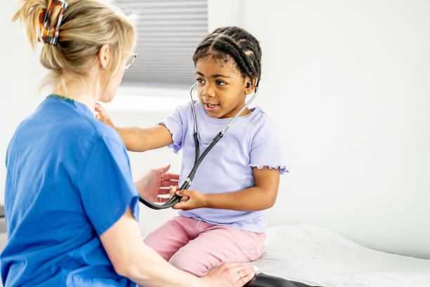 istock Child Learning About Health Care With Nurse Using Stethoscope Interaction 2219408112