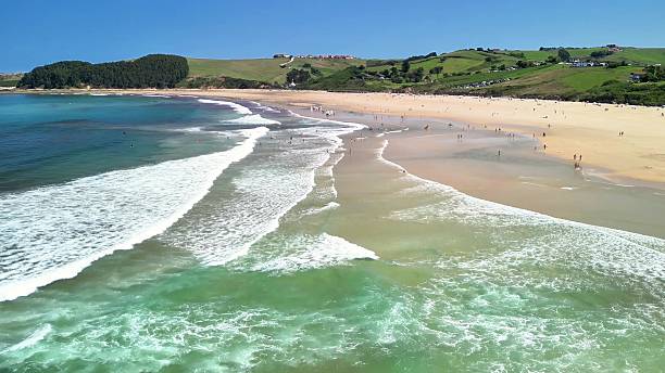istock Experience the breathtaking beachfront view with gentle waves and warm sunlight shining 2219410593