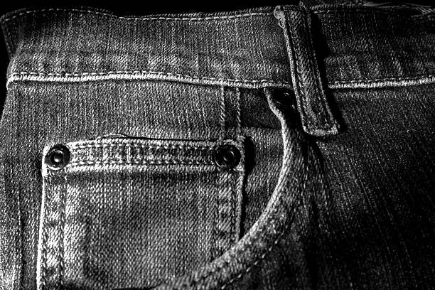 Black denim background.