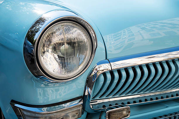 istock Vintage Blue Car Headlight and Grille Close-Up 2219415555
