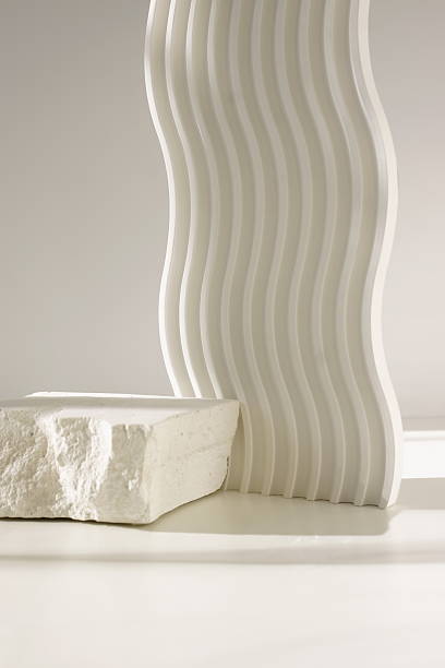 White stone pedestal, product presentation podium, template, white background, sunlight shadow. Abstract minimalist concept, empty podium display product, showcase for cosmetic products . Copy space