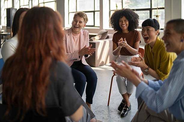 istock Diverse businesswomen clapping during a meeting in a modern office 2219417462