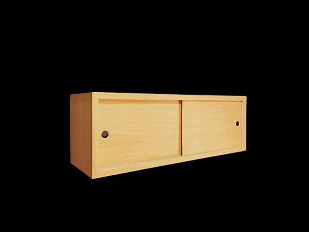 The black background in the picture is a wooden wall shelf with two sliding slots. It is used to hang things on the wall to store things in the house. It is made of wood and has a sliding cover.
