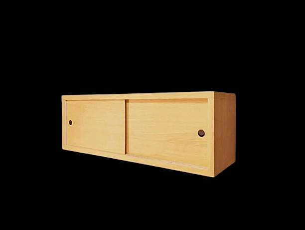 The black background in the picture is a wooden wall shelf with two sliding slots. It is used to hang things on the wall to store things in the house. It is made of wood and has a sliding cover.