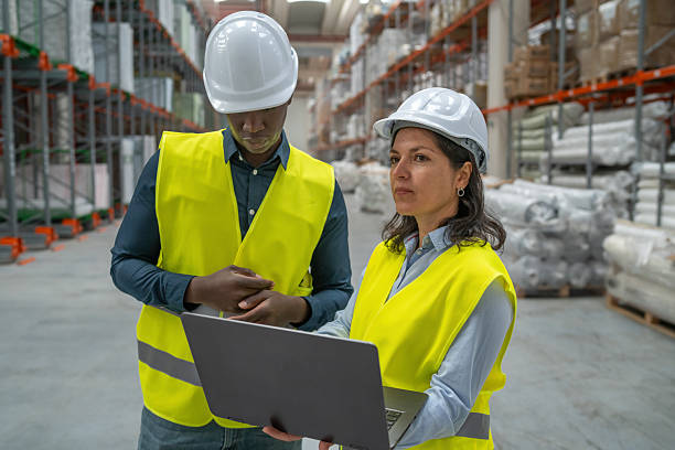 istock Confident Team Leader in Warehouse with Laptop 2219417842