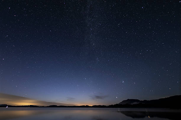 istock Night Sky Over a Calm Lake 2219419503