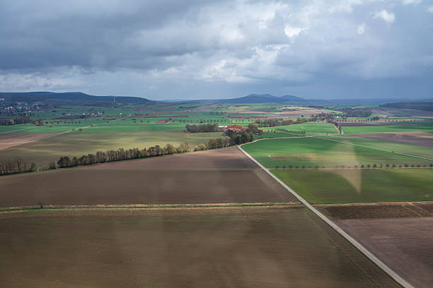 Aerial view of farmland and fields under a cloudy sky Goettingen, Germany