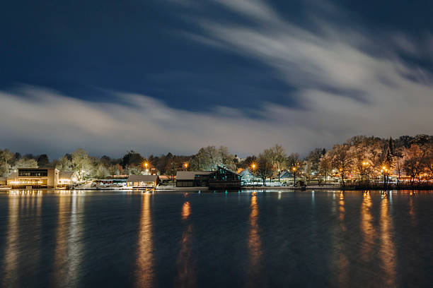 istock Nighttime Lake Scene with Illuminated Buildings and Reflections 2219419715