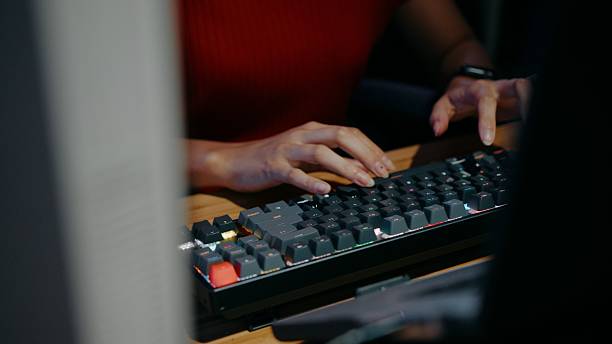 Close-up of programmer hands on mechanical keyboard