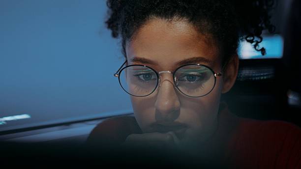 istock Close-up of Hispanic female programmer focused on computer screen 2219423524