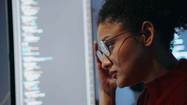 istock Close-up of Hispanic female software engineer working with code, representing women in tech and innovation 2219423539