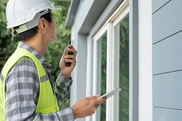 istock inspector or engineer is inspecting construction and quality assurance new house using a checklist. Engineers or architects or contactor work to build the house before handing it over to the homeowner 2219423623