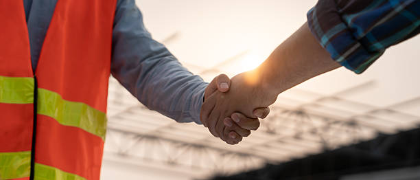 istock Engineer team hands shaking greeting start up plan new project contract in office center at construction site, industry ,architecture, partner, teamwork, agreement, property, contacts. 2219423658