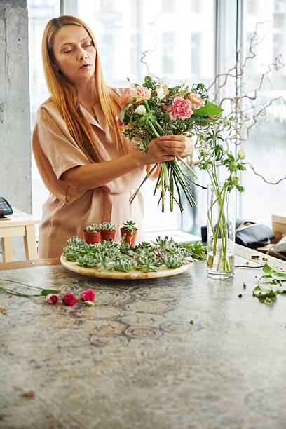 istock Woman making tender fresh flower bouquet 2219424185