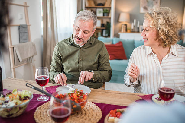 istock Mature married couple enjoying lunch at home 2219426604