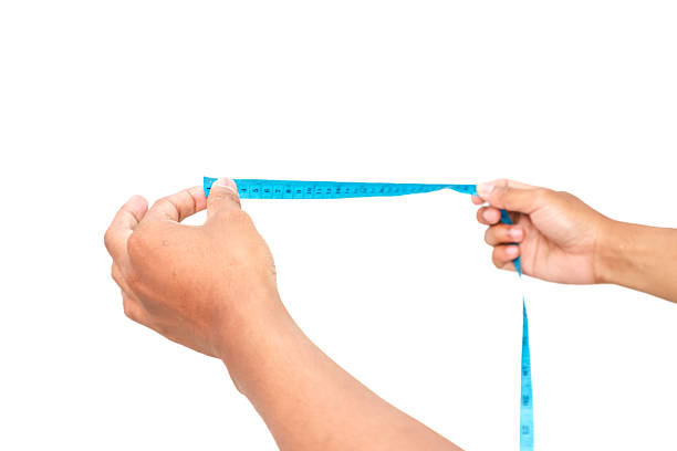 measuring tape in hand