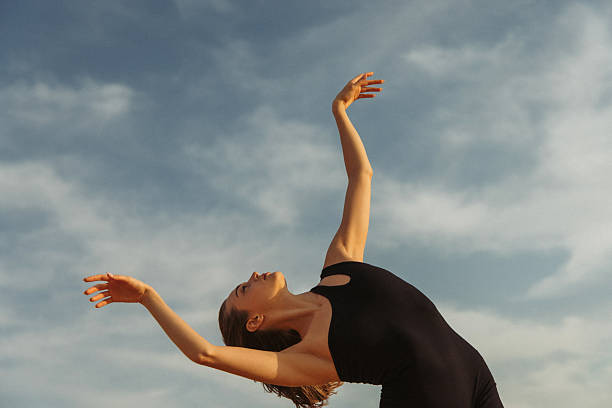 istock Graceful dancer expressing freedom under a calm sky 2219428834