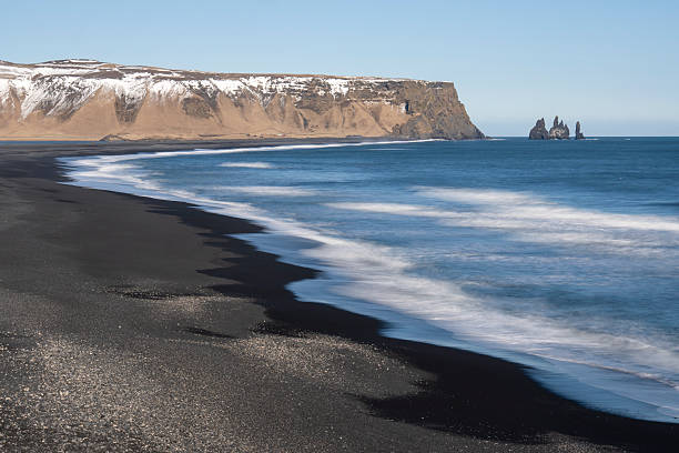 istock Black sand and  oceanic water on Reynisfjara beach, Iceland views from the Dyrholaey lighthouse and viewpoint on a sunny morning 2219430708