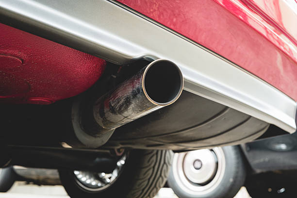 istock Single tip, chromed car exhaust tail pipe close up shot. Low angle, no people 2219430946