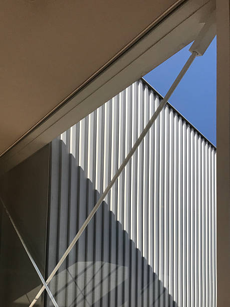 istock Modern glass framed the building metal structure with blue sky 2219432262
