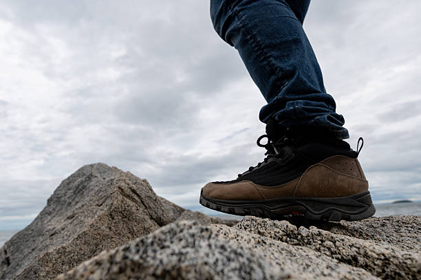 istock Person walking on rocks 2219434034