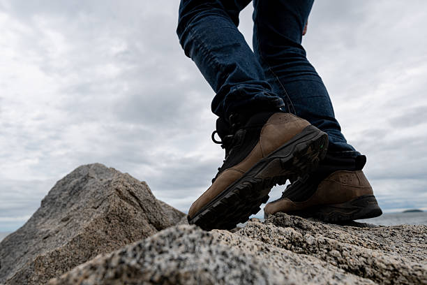 istock Person walking on rocks 2219434072
