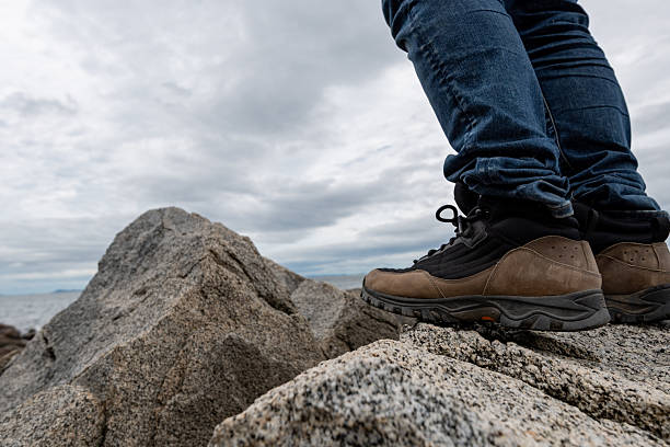 istock Person walking on rocks 2219434137