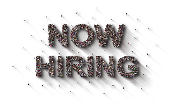 istock Large group of people forming Now Hiring lettering text 2219434520