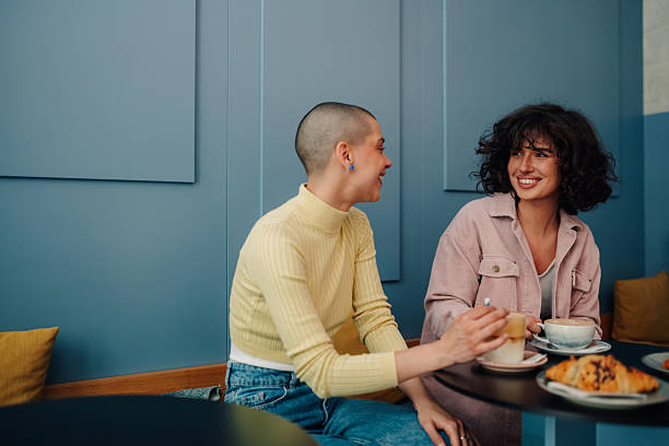 istock Two young women talking and having coffee in a cafe 2219435512