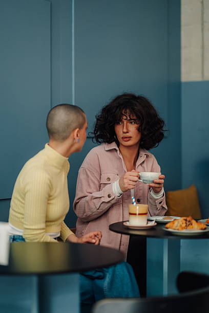 istock Two young women talking and having coffee in a cafe 2219435515