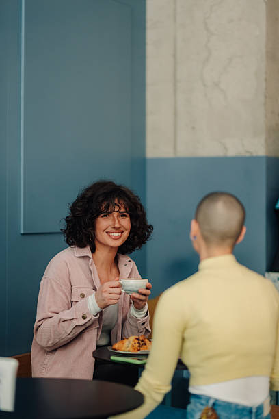 istock Two young women talking and having coffee in a cafe 2219435552