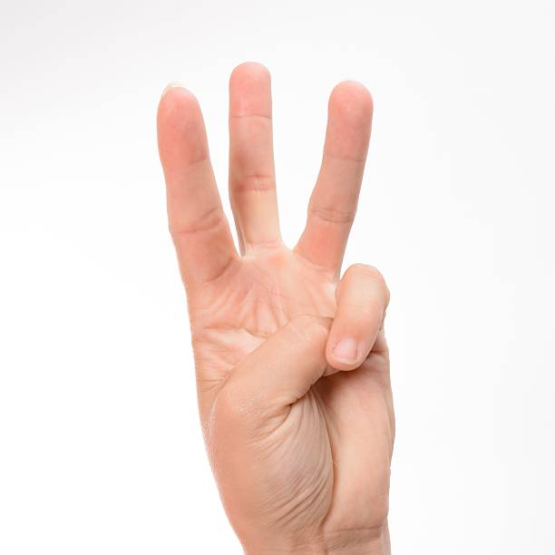 istock Hand gesturing the number three against a white background. 2219436954