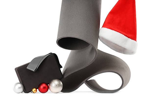 Yoga mat, block, Santa hat and baubles isolated on white