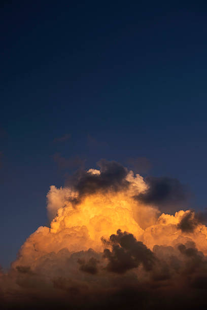 istock Golden Clouds Illuminated by Sunset Sky 2219444488