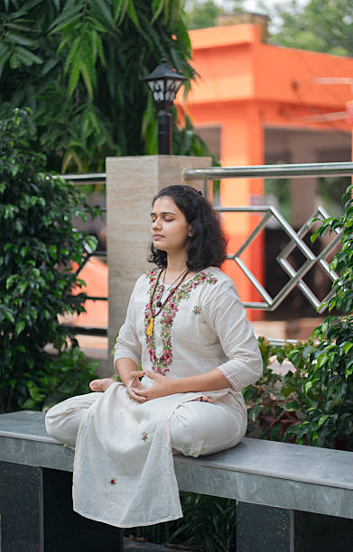 istock Peaceful Indian Woman Practicing Dhyana Meditation in Garden Setting 2219447351