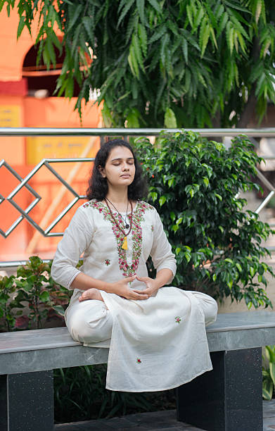 istock Peaceful Indian Woman Practicing Dhyana Meditation in Garden Setting 2219447403