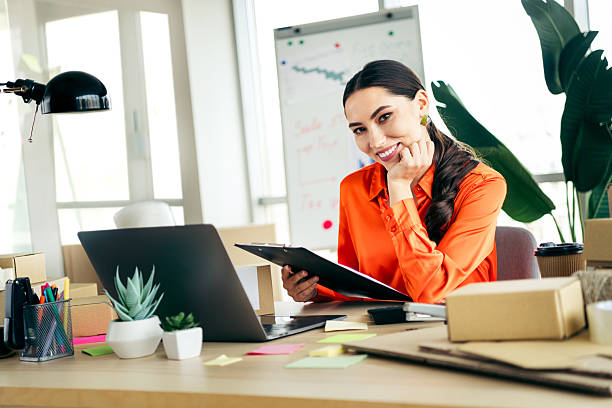 istock Professional entrepreneur managing online orders at their workspace, showcasing modern ecommerce and logistics expertise 2219450257