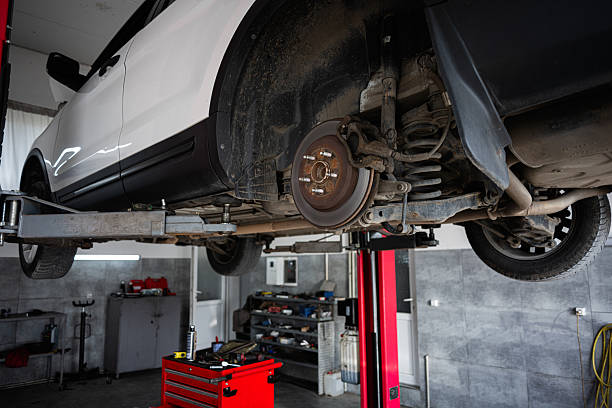 istock Car undergoing repair in a well-equipped automotive workshop 2219451593