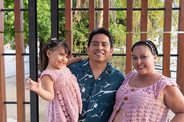 istock Happy hispanic family smiling and posing together 2219451878