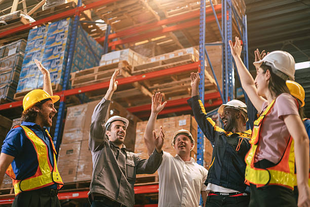 istock Group of worker in warehouse team cheerful together in inventory cargo building for teamwork people 2219455505