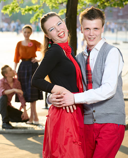 A group of young beautiful people (females and males) are walking together on Red Square in Moscow.