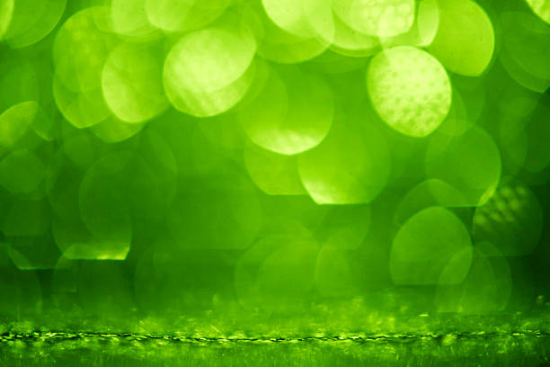 In this green color abstract bokeh backgrounds, defocused, blurred, glowing circle orbs float over a smooth color gradient, dusted with micro glitter to add texture and sparkle. The wide copy space and focus on foreground make it a turnkey template for web banner, header  design element, marketing, sale, or business useideal for campaigns centered on nature, environment, environmental issues, sustainable lifestyle, healthy lifestyle, freshness, and springtime events.