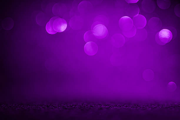 From deep aubergine to luminous amethyst, the color gradient bathes glowing bokeh circles in cinematic light while a sprinkle of fine glitter suggests hidden treasures. The image's open copy space turns it into an instant design element for e-gift voucher layouts, loyalty-program ads or premium sale coupons. The mood strikes a balance between mysterious beauty, sophisticated celebration and timeless romance, speaking directly to high-spend audiences.