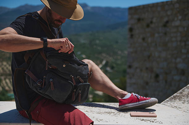 istock Traveler Exploring Medieval City With Backpack and Scenic Mountain View 2219460533