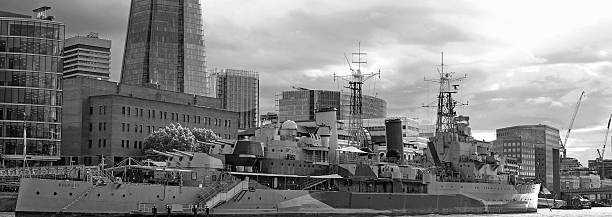 London, UK. June 4 2025 HMS Belfast , is a Town-class light cruiser that was built for the Royal Navy. It  is now permanently moored as a museum ship on the River Thames in London and is operated by the Imperial War Museum
