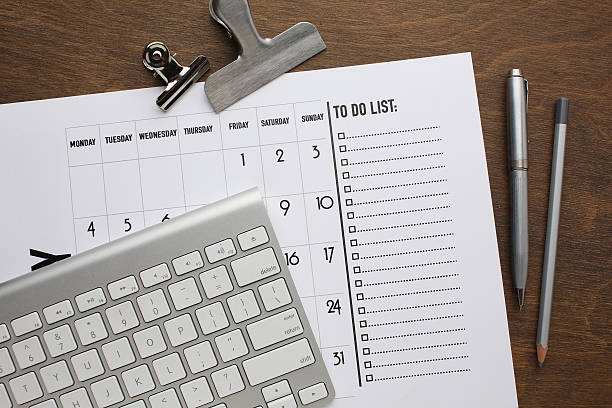 istock Desktop calendar on a modern desktop. Schedule and time planning in office and business. 2219464109